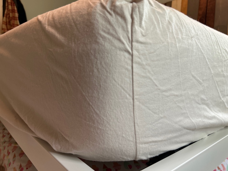 A close look at the corner fitment of a Saatva Flannel fitted sheet.