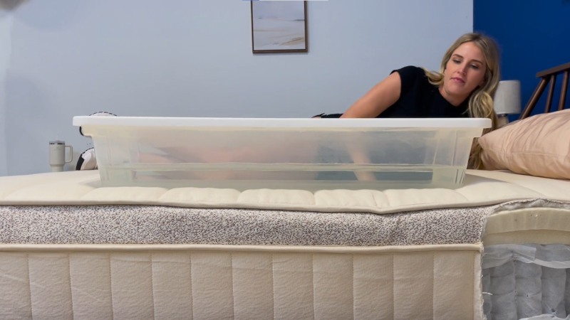 Our tester performing a ripple test on a Birch Luxe Natural Mattress