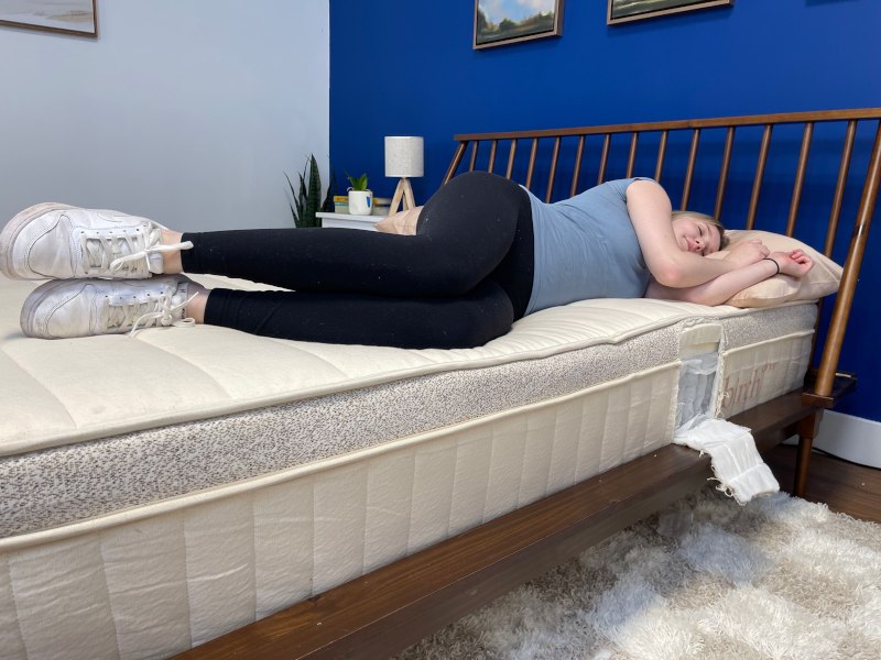 Our tester side sleeping on a Birch Luxe Natural Mattress