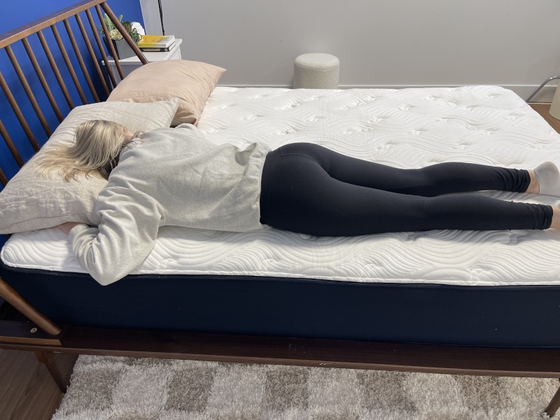 Our tester stomach-sleeping on the Big Fig Classic Mattress