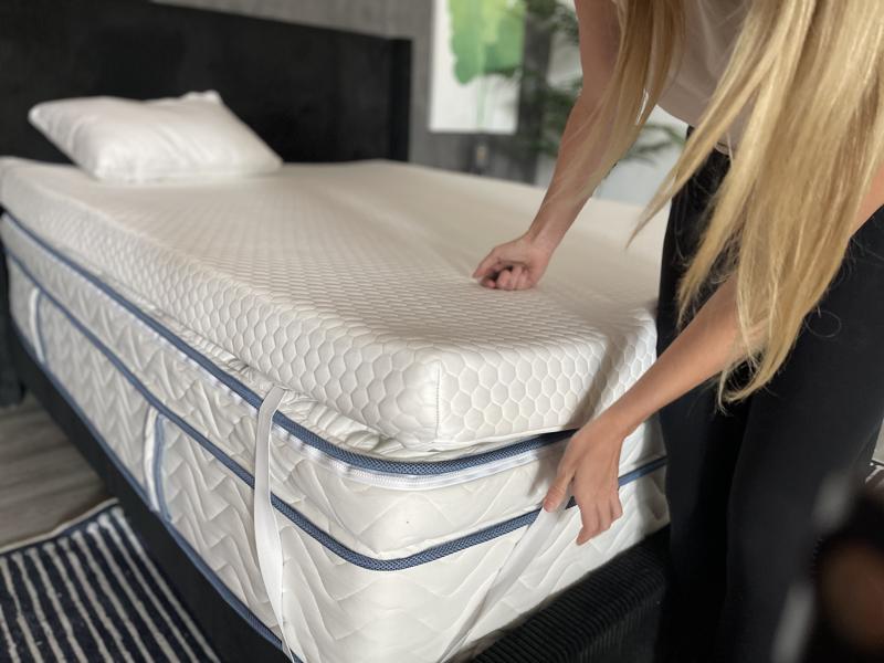 Our product tester uses the corner strap on a Helix GlacioTex Premium Topper