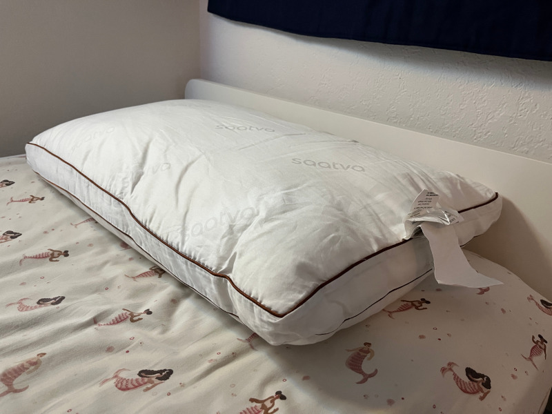 The Saatva Latex Pillow on a bed at the Sleepopolis studio