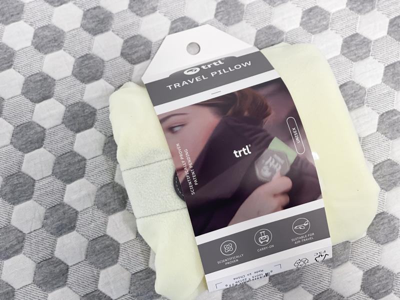 Looking at a trtl Travel Pillow In the Packaging