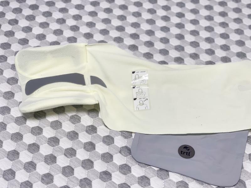 An unwrapped trtl Travel Pillow at the Sleepopolis studio.