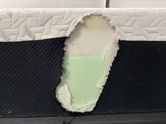 A closeup of the foam layers of the Nectar Premier Memory Foam mattress, as seen from the side.