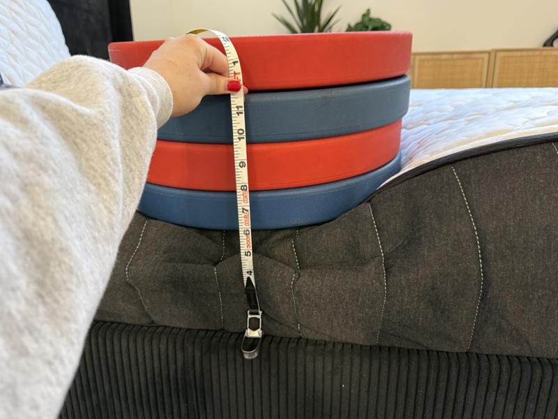 Measuring the deflection of weight plates on the edge of the Titan Plus Core Mattress