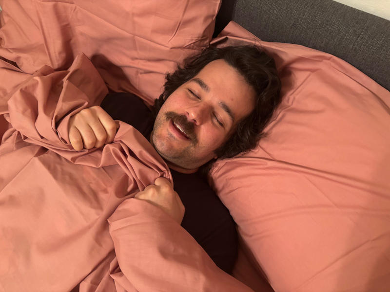 Our product tester thoroughly enjoying a set of Silk & Snow Cotton Percale Bed Sheets