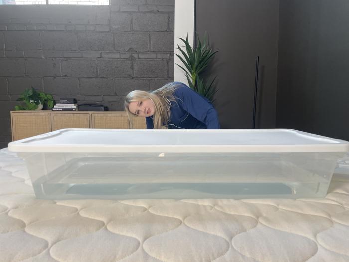 Our tester performs a ripple test on the WinkBed EcoCloud Hybrid Mattress