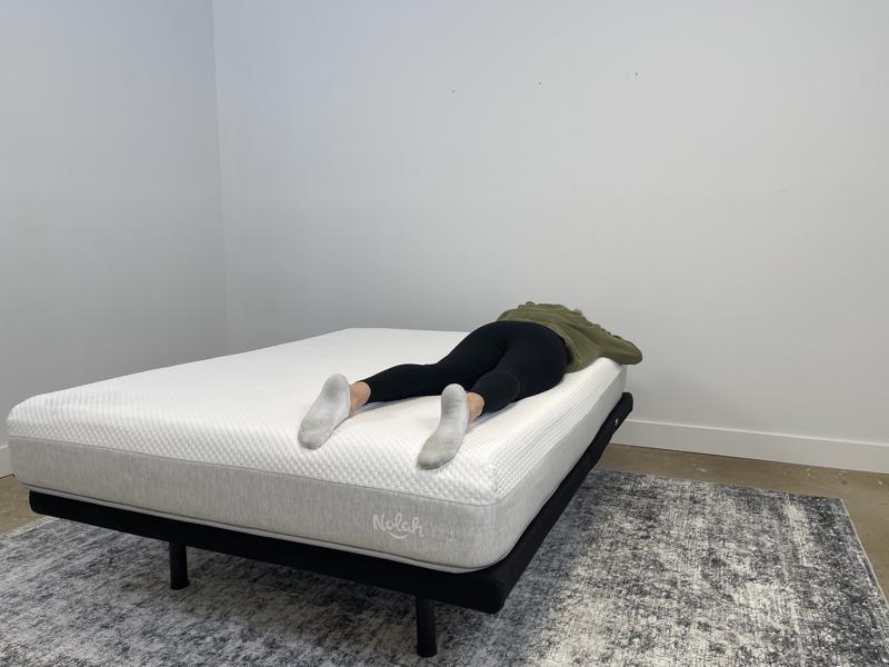 Our tester stomach-sleeping on the Nolah Original AF Mattress